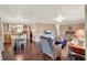 Open-concept living area features hardwood floors and dining space at 105 Canal Vw, Eustis, FL 32726