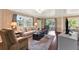 Comfortable living room with neutral colors, area rug, and backyard view at 105 Canal Vw, Eustis, FL 32726