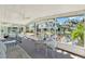 Enjoy serene canal views from this spacious screened porch with comfortable seating at 105 Canal Vw, Eustis, FL 32726