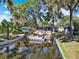 Picturesque waterfront view of a canal with boats docked, enhancing the property's serene and tranquil setting at 105 Canal Vw, Eustis, FL 32726