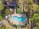 A lovely community pool provides ample seating, landscaping, and fencing at 1233 Bramley Ln, Deland, FL 32720