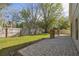 Enjoy the lush green lawn and extended patio with stacked stone features for a serene outdoor living space at 1233 Bramley Ln, Deland, FL 32720
