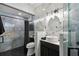 Bathroom with vanity, sink, framed mirror, toilet, and a glass-enclosed shower at 1233 Bramley Ln, Deland, FL 32720