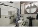 Modern bathroom featuring penny tile and a walk-in shower with overhead shower head and built-in shower niche at 1233 Bramley Ln, Deland, FL 32720