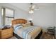 Bright bedroom features a ceiling fan and a large window allowing natural light, creating a welcoming and relaxing atmosphere at 1233 Bramley Ln, Deland, FL 32720