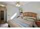 Bright bedroom features a ceiling fan and a large window allowing natural light, creating a welcoming and relaxing atmosphere at 1233 Bramley Ln, Deland, FL 32720