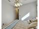 Bright bedroom features a ceiling fan and a large window allowing natural light, creating a welcoming and relaxing atmosphere at 1233 Bramley Ln, Deland, FL 32720