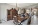 Charming dining room adjacent to the kitchen, featuring a wooden table and decorative lighting at 1233 Bramley Ln, Deland, FL 32720
