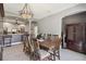 Spacious dining area with arched doorways, a large table, and stylish decor at 1233 Bramley Ln, Deland, FL 32720