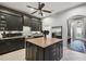 Open kitchen design with island, modern appliances, granite countertops, and ample cabinet space at 1233 Bramley Ln, Deland, FL 32720