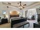 Spacious main bedroom featuring a tray ceiling, decorative lighting, and a seating area at 1233 Bramley Ln, Deland, FL 32720