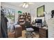 Office with ceiling fan, bookshelves, file cabinet, desk, and natural light from the exterior window at 1233 Bramley Ln, Deland, FL 32720