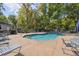 Community pool area with seating and landscaping at 1233 Bramley Ln, Deland, FL 32720