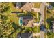 Aerial view of house with pool, backyard, landscaping, and street view at 12720 Greco Dr, Orlando, FL 32824