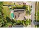 Aerial view of home, swimming pool, backyard, and surrounding neighborhood at 12720 Greco Dr, Orlando, FL 32824