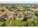 Aerial view of home showcasing the pool, fenced yard, and landscaped surroundings at 12720 Greco Dr, Orlando, FL 32824