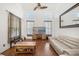 Living room featuring high ceilings, large windows, and stylish furnishings at 12720 Greco Dr, Orlando, FL 32824