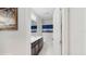 Clean bathroom featuring a vanity with a sink, dark cabinets, a toilet, and a shower with blue curtain at 14345 Wabasso Loop, Winter Garden, FL 34787