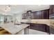 Well-equipped kitchen features a granite island, stainless steel appliances, and ample cabinet space at 14345 Wabasso Loop, Winter Garden, FL 34787