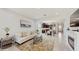 Spacious living area with wood flooring, neutral decor, and abundant natural light at 14345 Wabasso Loop, Winter Garden, FL 34787