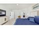 Inviting main bedroom showcasing an ensuite bathroom, TV, and tile floors at 14345 Wabasso Loop, Winter Garden, FL 34787