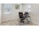 This home office features carpeted floors, neutral walls, and a large window for plenty of natural light at 14345 Wabasso Loop, Winter Garden, FL 34787