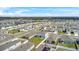 New residential community featuring modern homes with well-manicured lawns and sidewalks in a Gathering-friendly neighborhood at 1506 Finnigan Cir, Haines City, FL 33844