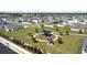 Aerial view of a community park with playground and picnic pavilions surrounded by residential homes at 1506 Finnigan Cir, Haines City, FL 33844