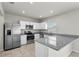 Modern kitchen with stainless steel appliances, granite counters and bright, recessed lighting at 1506 Finnigan Cir, Haines City, FL 33844