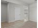 Bright living room with neutral carpet and tile flooring leading to the kitchen at 1506 Finnigan Cir, Haines City, FL 33844