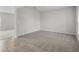 Bright living room with neutral carpet, tiled entryway, and plenty of natural light at 1506 Finnigan Cir, Haines City, FL 33844