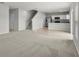 Inviting living space showcasing an open floor plan with modern finishes and staircase at 1506 Finnigan Cir, Haines City, FL 33844
