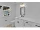 Modern bathroom featuring a rectangular mirror, toilet, and vanity at 1602 Park Lake St # 2, Orlando, FL 32803