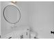 Bathroom with a modern mirror, vanity, toilet and black fixtures at 1602 Park Lake St # 2, Orlando, FL 32803