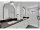 Modern bathroom featuring dual sinks, shaker cabinets and a glass enclosed shower at 1602 Park Lake St # 2, Orlando, FL 32803