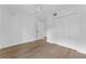 Bright bedroom with hard wood floors, a ceiling fan and white trim throughout at 1602 Park Lake St # 2, Orlando, FL 32803