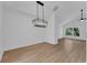 Bright dining room with a stylish light fixture and lots of natural light at 1602 Park Lake St # 2, Orlando, FL 32803
