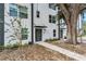 Contemporary townhouse shows sleek design with clean lines, dark accents, and attractive landscaping at 1602 Park Lake St # 2, Orlando, FL 32803