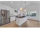 Modern kitchen features white cabinetry, stainless steel appliances, and black countertops at 1602 Park Lake St # 2, Orlando, FL 32803