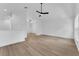Spacious living room showcases light wood flooring, vaulted ceilings, and modern lighting fixtures at 1602 Park Lake St # 2, Orlando, FL 32803