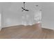 Open living area boasts vaulted ceilings, stylish ceiling fan, and access to the modern kitchen at 1602 Park Lake St # 2, Orlando, FL 32803