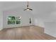 Bright living room features large windows, vaulted ceilings, and light wood flooring at 1602 Park Lake St # 2, Orlando, FL 32803