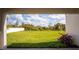 View of the large backyard, featuring lush green grass and beautiful landscaping at 1639 Meadowlark Dr, Deltona, FL 32725