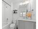Well-lit bathroom featuring a shower-tub combo and a vanity with contemporary fixtures at 1639 Meadowlark Dr, Deltona, FL 32725