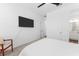 Bright bedroom with carpet, a ceiling fan, large window, television, and an ensuite bathroom at 1639 Meadowlark Dr, Deltona, FL 32725