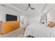 Bright bedroom leads into main bathroom with neutral walls, carpet flooring, and a large dresser at 1639 Meadowlark Dr, Deltona, FL 32725