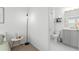 Bright bedroom featuring carpet flooring, a modern lamp, and an ensuite bathroom with nice vanity at 1639 Meadowlark Dr, Deltona, FL 32725