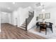 Inviting view of dining area with modern table, stairs and access to the living area at 1639 Meadowlark Dr, Deltona, FL 32725
