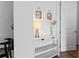 Bright entryway with white console table, decorative items, and wood-look floors, creating a welcoming atmosphere at 1639 Meadowlark Dr, Deltona, FL 32725