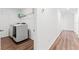 Laundry room with modern washer and dryer, plus additional storage space and wood flooring at 1639 Meadowlark Dr, Deltona, FL 32725